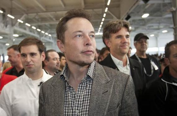 CEO Elon Musk, center, with CTO J.B. Straubel, left, and Chief Designer Franz von Holzhausen watch as Tesla launched the Model S, at their factory in Fremont, Calif., on Friday, June 22, 2012. The event marked the start of its Fremont assembly line and, the company hopes, eventual entry into the mass market with its revolutionary electric car. (Patrick Tehan/Staff)